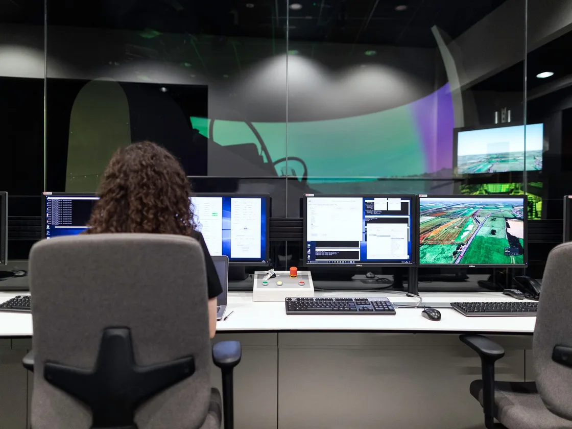IT specialist at a monitoring workstation